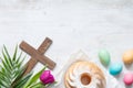 Easter colorful spring tulips with palm cross cake and eggs decoration on white wooden natural background Royalty Free Stock Photo