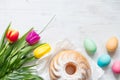 Easter colorful spring tulips with palm and eggs decoration on white wooden natural background Royalty Free Stock Photo