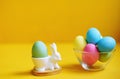 Easter. Colourful eggs. Food. Celebrate holidays. Multicolour. Yellow background