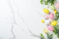 Easter composition with Bunny ears, colored eggs and green plants. Royalty Free Stock Photo