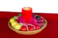 Easter composition with a candle and the painted eggs decorated