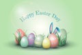 Easter composition of colorful eggs, green grass, places for inscriptions and ears of a hare on a blue background. The Royalty Free Stock Photo