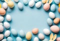 Easter composition concept. Top view photo of white circle colorful easter eggs and bunny ears on isolated pastel blue background Royalty Free Stock Photo