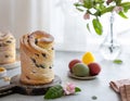 Easter composition with Cruffin Kulich, painted eggs, blossoming apple branch