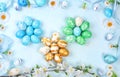 Easter composition with decorated eggs and flowering branches, abstract spring card, happy holiday concept, background, banner for Royalty Free Stock Photo