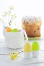 Easter composition with eggs holiday cake and flowering branches on wooden Royalty Free Stock Photo