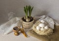 Easter composition with eggs in a nest, incense, church candles and geocynts