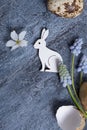 Easter composition with flowers, white rabbit and eggs flat lay, top view Royalty Free Stock Photo