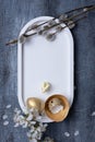 Easter composition with flowers, white rabbit and eggs flat lay, top view. Blank Easter greeting card. Royalty Free Stock Photo