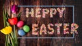 Easter composition and the inscription Happy Easter made of colored sugar. Royalty Free Stock Photo