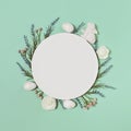 Easter composition made of easter bunny, eggs and flowers on pastel background with round shape paper card. Minimal holiday Royalty Free Stock Photo