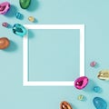 Easter composition made with colorful eggs on bright blue background. Creative minimal holiday concept. Flat lay. Happy Easter. Royalty Free Stock Photo