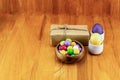 Easter composition. pair of eggs yellow lilac craft giftbox bowl of candy