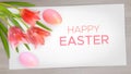 Easter composition with realistic pink tulips, Easter eggs on wood background Royalty Free Stock Photo