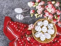 Easter composition with white and black polka dot eggs in a basket, red polka dot shawl, eustoma flowers Royalty Free Stock Photo