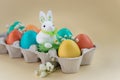 Easter concept with a bunny in nest. Painted easter eggs in egg Royalty Free Stock Photo