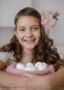 Easter concept. Cute teens girl holding Easter eggs