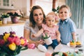 Happy and loving mother and her kids preparing home decoration Royalty Free Stock Photo