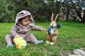 One year baby boy playing on the grass in rabbit suit Royalty Free Stock Photo