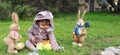 One year baby boy playing on the grass in rabbit suit Royalty Free Stock Photo