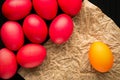 Easter concept painted eggs on black background and red for holiday with place for text red egg and paper Royalty Free Stock Photo