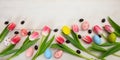 Easter concept. Pink tulips and easter eggs on white wooden background, copy space, top view, banner Royalty Free Stock Photo