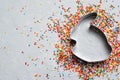 Easter Concept, Sugar Sprinkles and Cookie Cutter on Grey Background Royalty Free Stock Photo