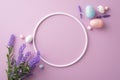 Top view photo of empty circle pink blue white easter eggs and bouquet of lavender flowers on isolated lilac background Royalty Free Stock Photo