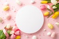 Top view photo of white circle bouquets of fresh tulips with silk ribbon colorful easter eggs sprinkles on pastel pink background
