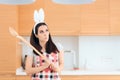 Easter Cook with Bunny Ears and Huge Wooden Spoon Royalty Free Stock Photo