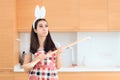 Easter Cook with Bunny Ears and Huge Wooden Spoon Royalty Free Stock Photo