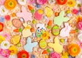 Easter cookies eggs Bunny candy and colorful spring flowers on pastel background Royalty Free Stock Photo