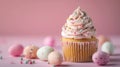Easter cupcake decorated sprinkles on pink background and Easter eggs. Easter greeting card Royalty Free Stock Photo