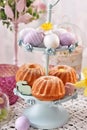 Easter cupcakes on metal cakestand on festive table Royalty Free Stock Photo