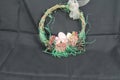 Easter deco in close-up. Wreath wicker with arrangement.