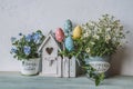 Easter decor with bird house and spring flowers