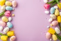 Top view photo of colorful easter eggs flowers yellow pink tulips and confetti on isolated lilac background Royalty Free Stock Photo