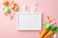 Top view photo of photo frame with easter bunny ears colorful eggs carrots baking mold and sprinkles