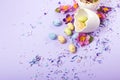 Easter decor in pastel colors. Easter eggs, candy, sweets, flowers and eggshells Royalty Free Stock Photo
