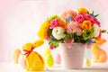 Easter decoration with beautiful spring flowers in vase, Easter eggs and bunny on white wooden table. Easter concept Royalty Free Stock Photo