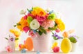 Easter decoration with beautiful spring flowers in vase Easter eggs and bunny on white wooden table. Easter concept Royalty Free Stock Photo