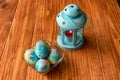 Easter decoration - blue, colorful painted eggs with gemstones and a blue candle lantern