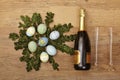 Easter decoration, champagner bootle and champagne glasses on wood Royalty Free Stock Photo