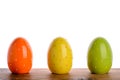 Easter decoration- colorful eggs on the wooden board.