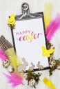Easter decoration with Easter eggs on white wood background Royalty Free Stock Photo