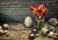Easter decoration with eggs tulip flowers. Vintage toned Royalty Free Stock Photo