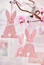 Easter decoration with paper rabbits hanging on willow branch Royalty Free Stock Photo