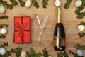 Easter decoration, present, champagner bootle and champagne glasses on wood Royalty Free Stock Photo