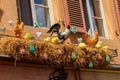 Easter decoration with rooster, hens and chickens in nest on a house Royalty Free Stock Photo