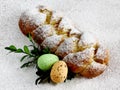 Sweet braided homemade bread with two easter eggs and twig with leaves Royalty Free Stock Photo